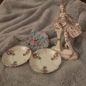 3 small teacup plates. Statue